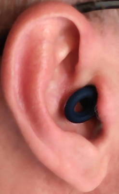 Loop Quiet earplugs in author's ear.